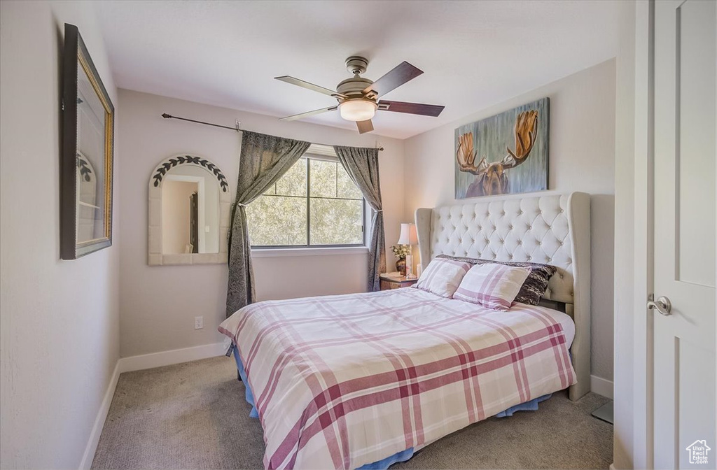 Bedroom featuring carpet and a ceiling fan