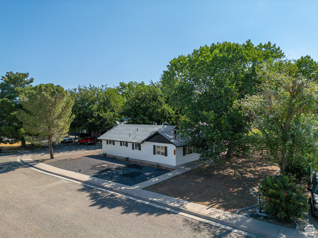 View of front of home with a shingled roof