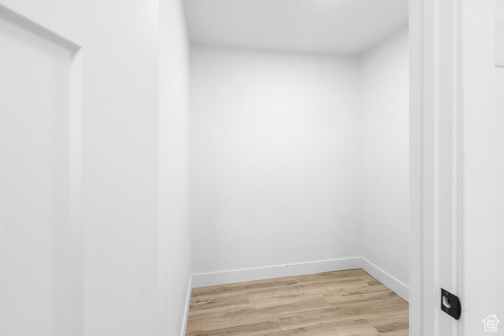 Walk in closet featuring light wood finished floors
