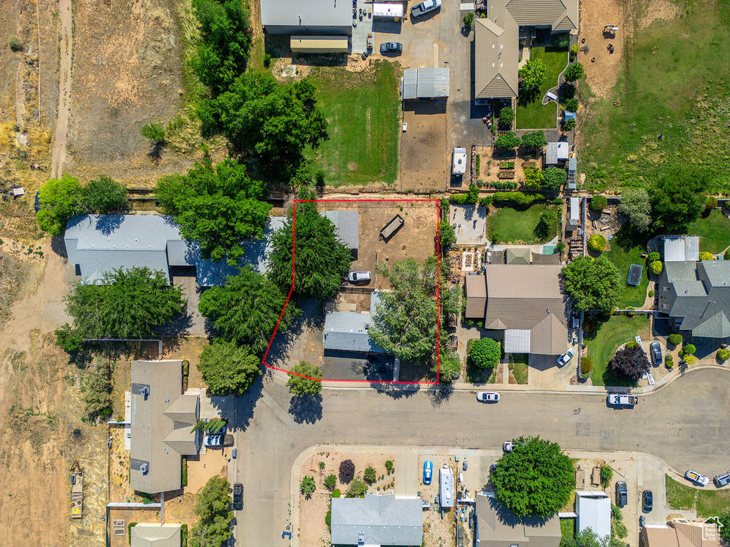 Aerial view of residential area featuring property boundaries highlighted
