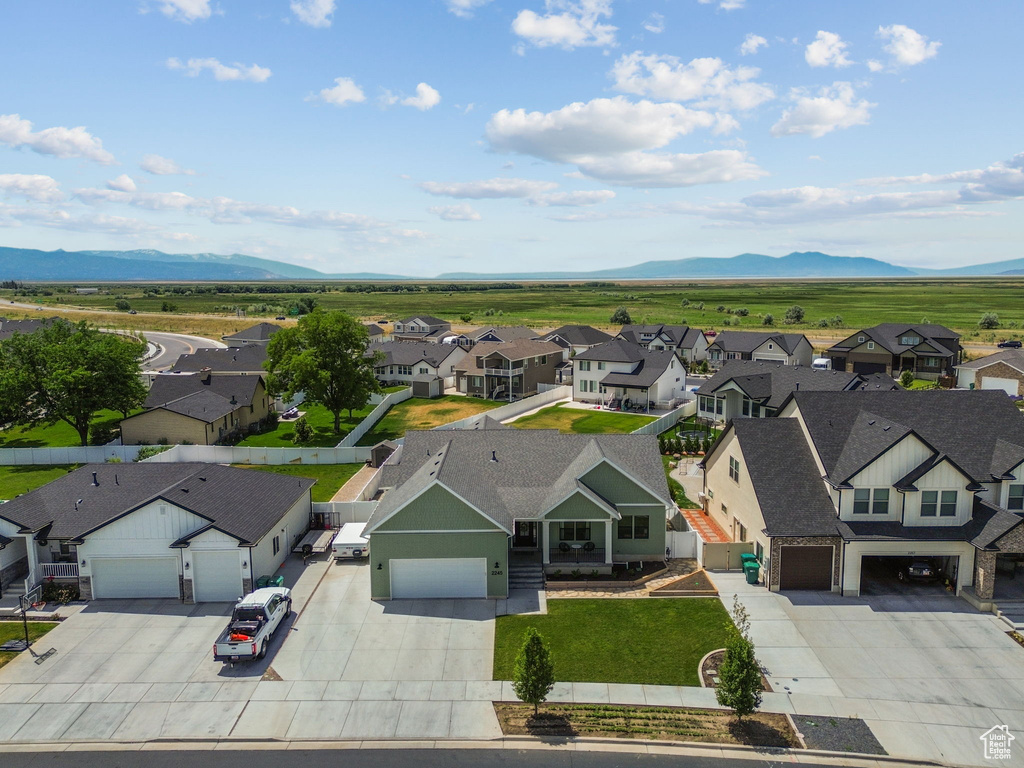 Aerial perspective of suburban area featuring a mountain backdrop
