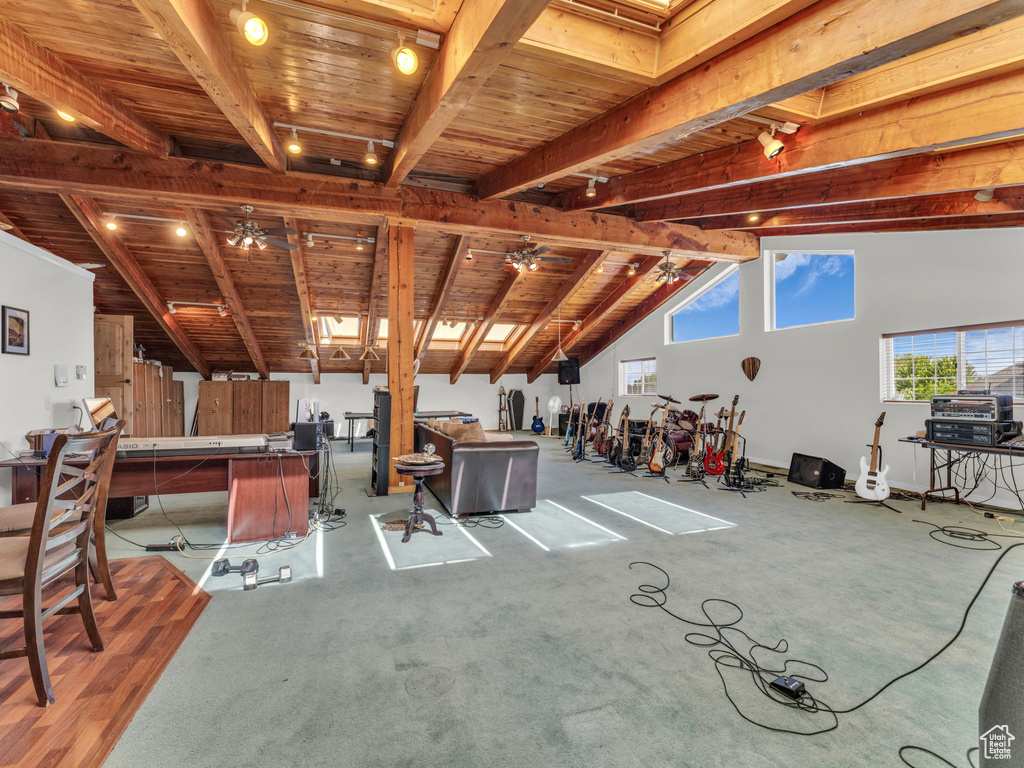 Misc room with wooden ceiling, carpet flooring, and ceiling fan
