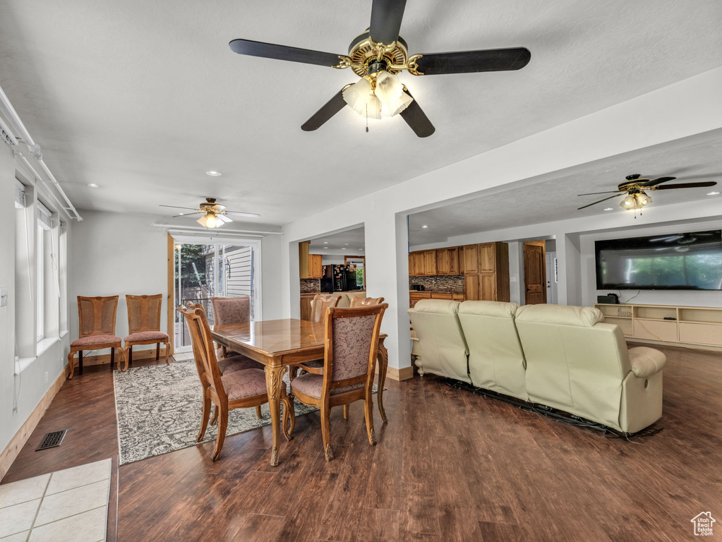 Dining area featuring a ceiling fan, wood finished floors, and recessed lighting