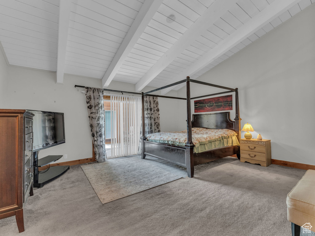 Carpeted bedroom with wood ceiling and access to outside