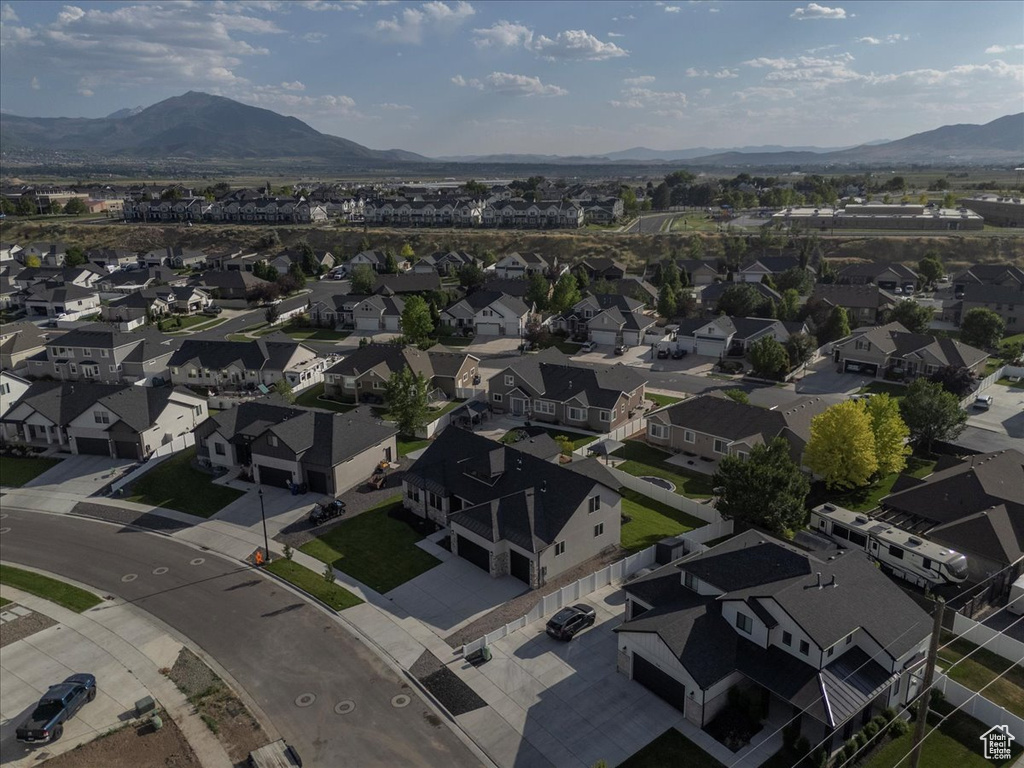 View of property location featuring mountains and nearby suburban area