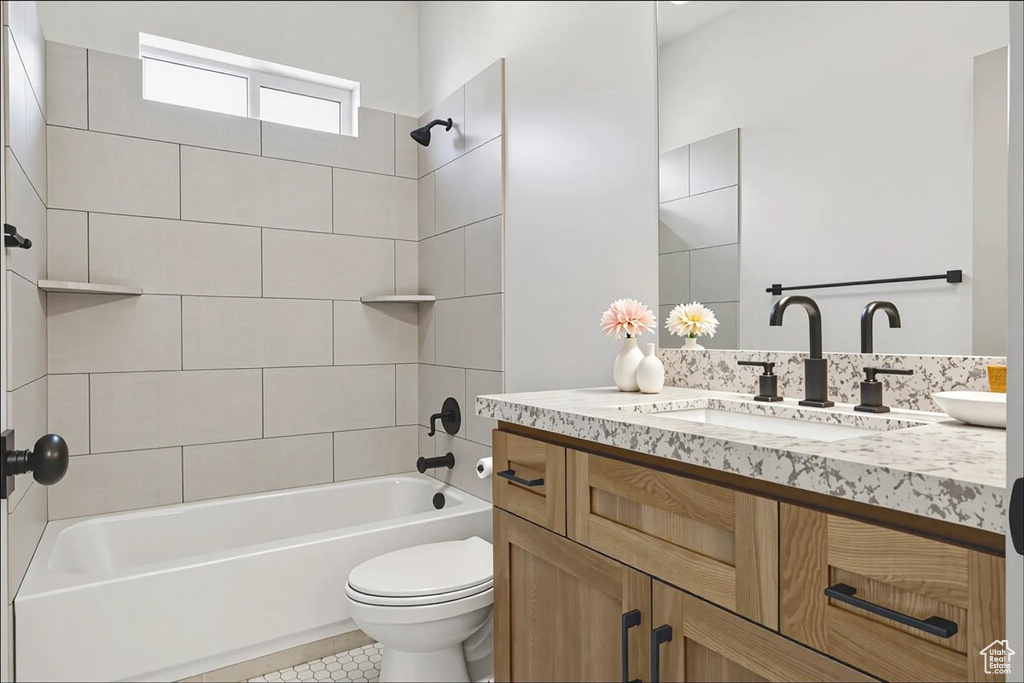 Full bath with vanity, bathing tub / shower combination, and tile patterned flooring
