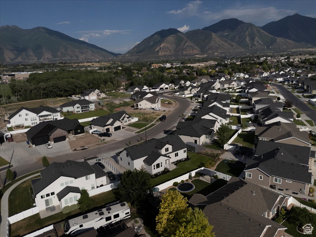 Aerial view of property\\\'s location with a mountainous background and nearby suburban area