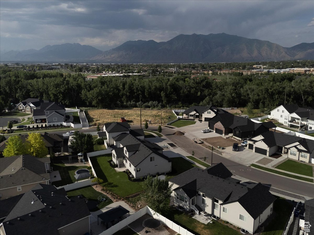 View of property location featuring mountains and nearby suburban area