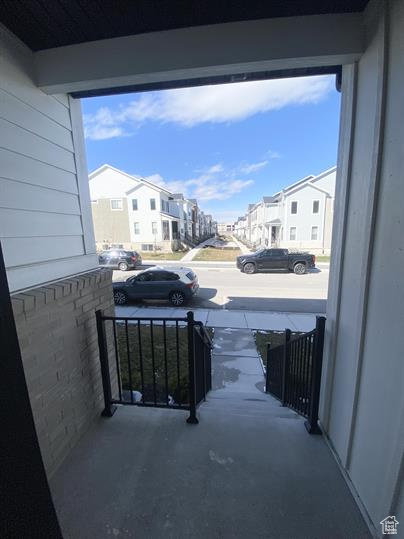 Covered porch with a residential view
