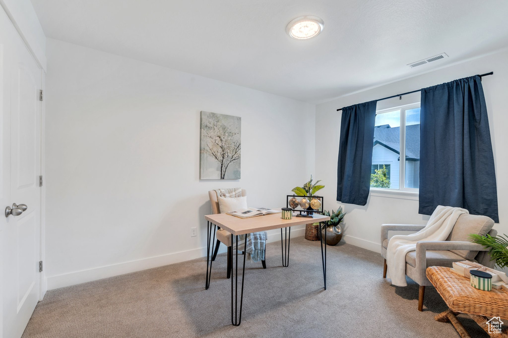 Carpeted office with baseboards