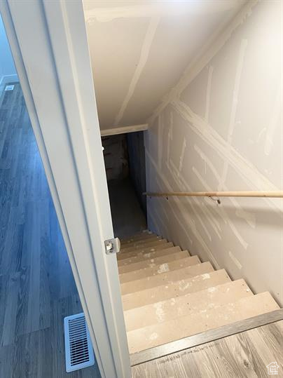 Staircase with wood finished floors