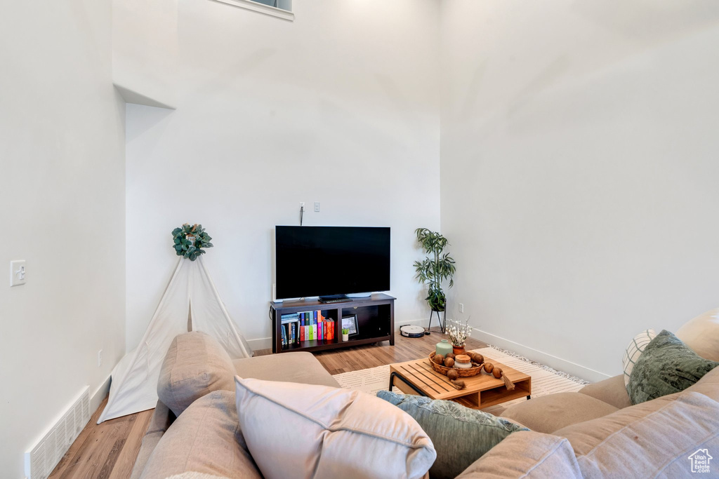 Living area featuring wood finished floors and baseboards