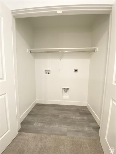 Laundry room with electric dryer hookup, washer hookup, and wood finished floors