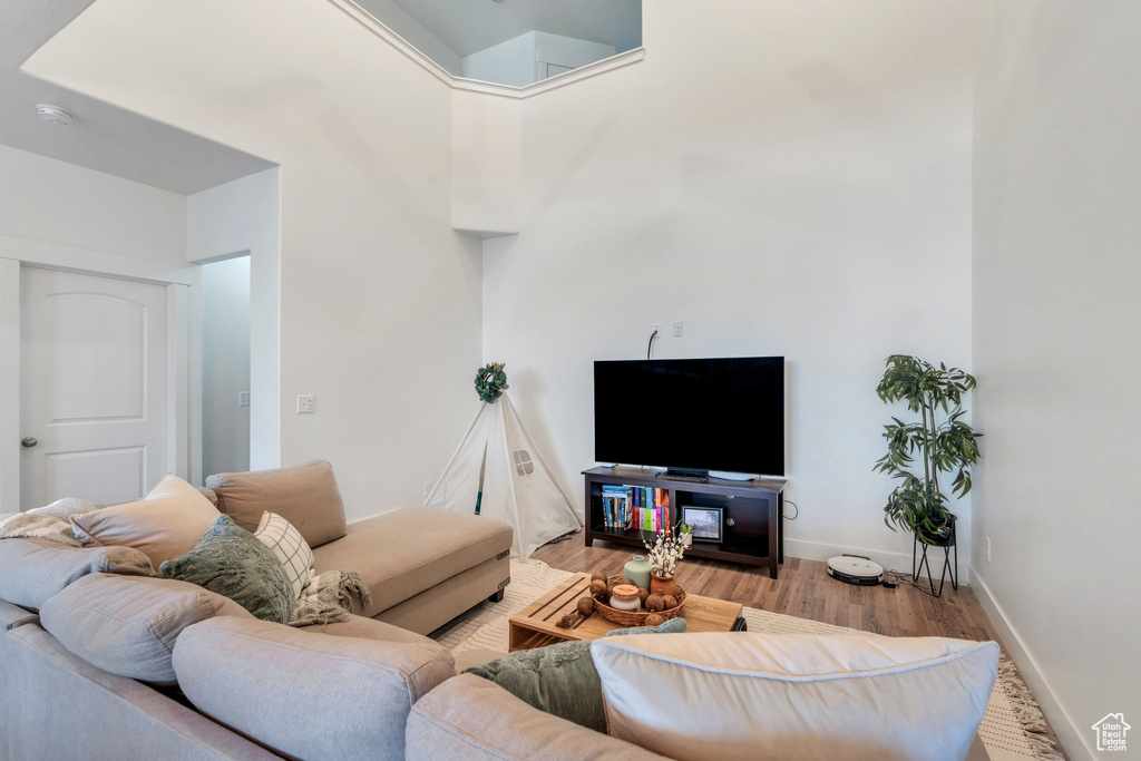 Living room with wood finished floors and baseboards