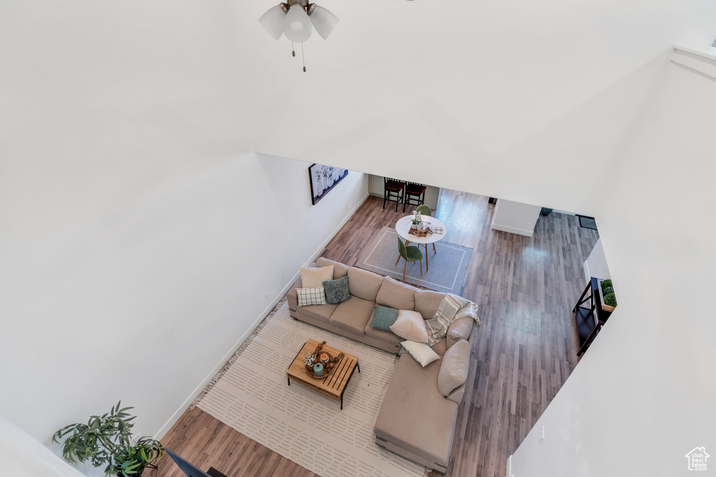 Living room with wood finished floors and ceiling fan