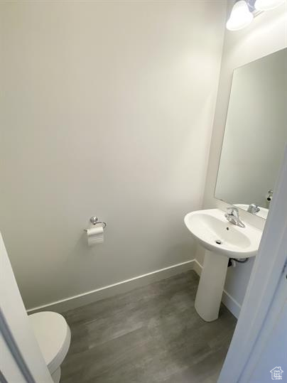 Bathroom with baseboards and toilet