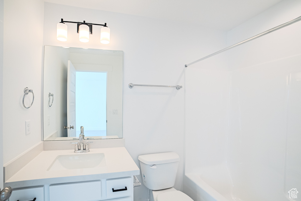 Bathroom featuring shower / bath combination and vanity