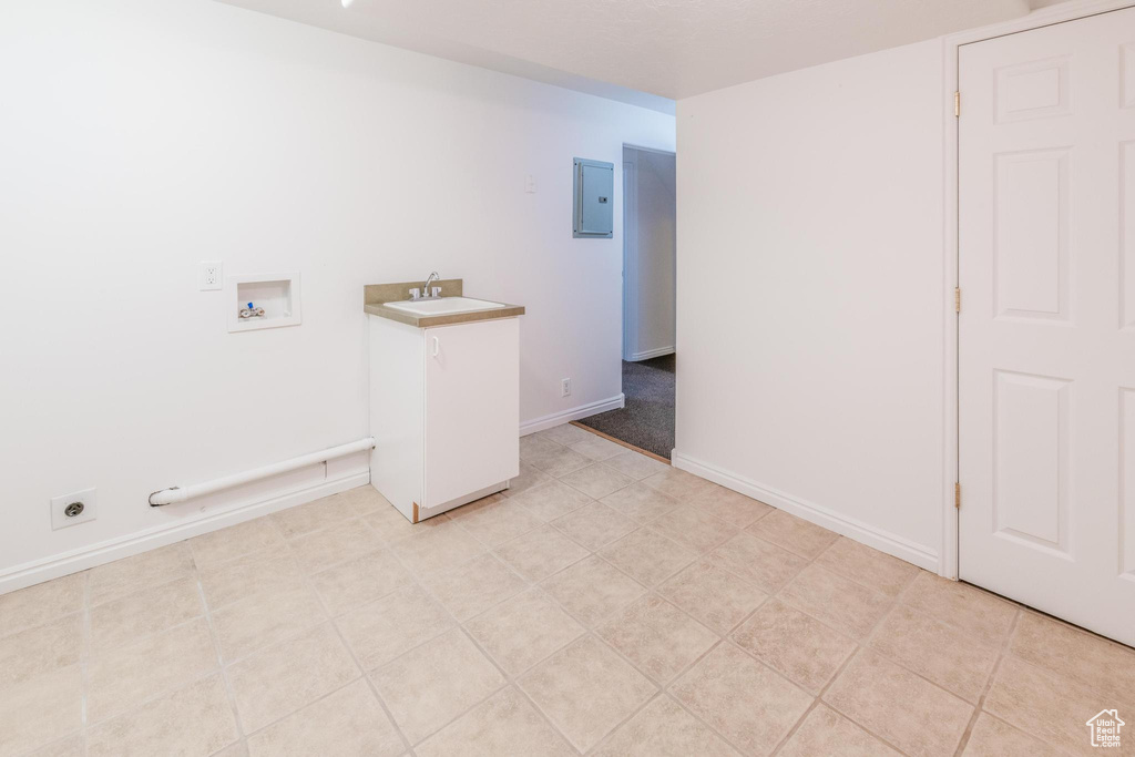 Laundry room featuring hookup for a washing machine, hookup for an electric dryer, and electric panel