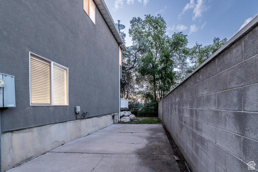 View of property exterior featuring a patio area and stucco siding