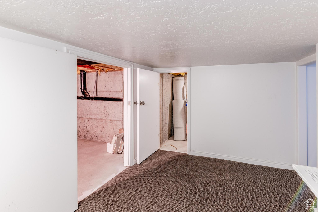 Interior space featuring a textured ceiling