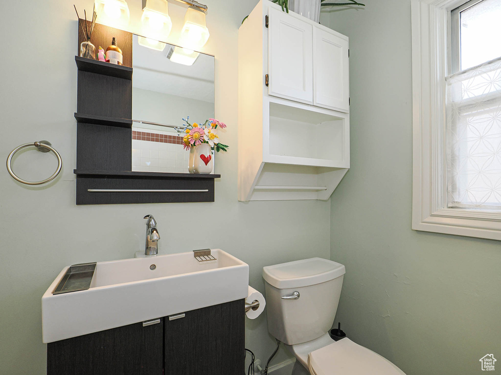 Bathroom featuring toilet and vanity