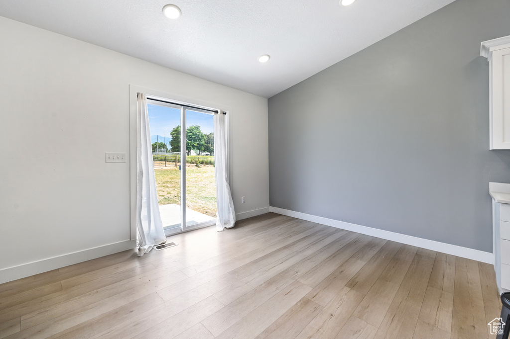 Spare room featuring light wood-style floors and recessed lighting