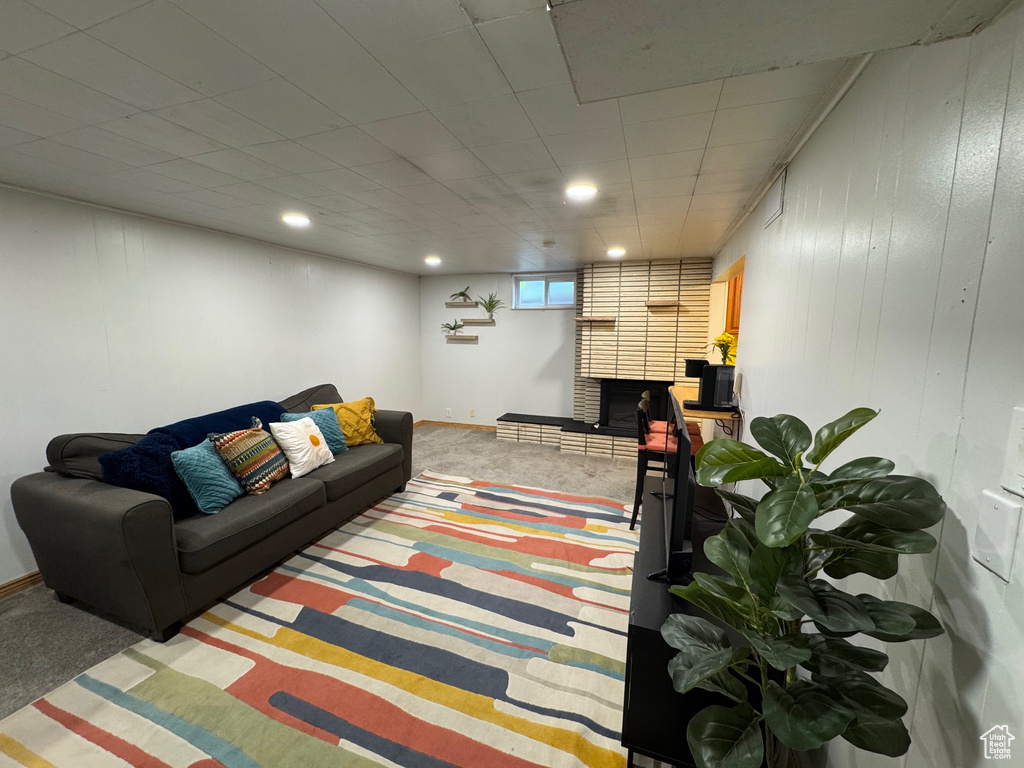 Carpeted living room featuring recessed lighting