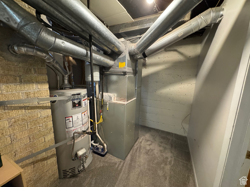 Utility room with strapped water heater