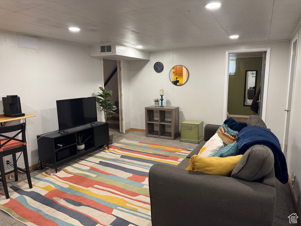 Carpeted living room featuring recessed lighting