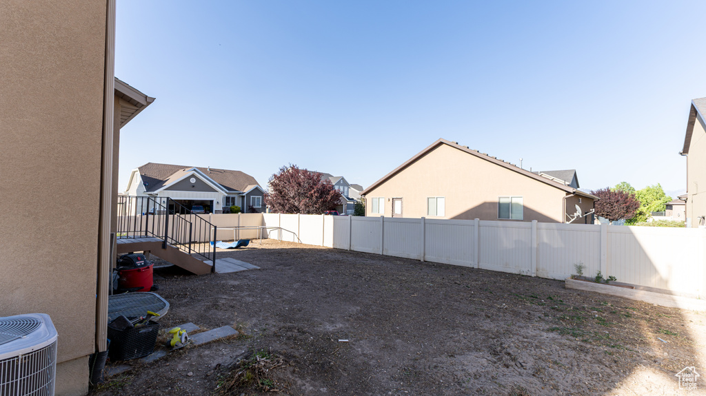 Fenced backyard with a residential view