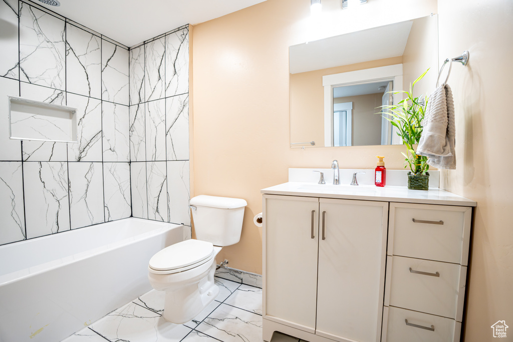 Full bathroom featuring vanity and washtub / shower combination