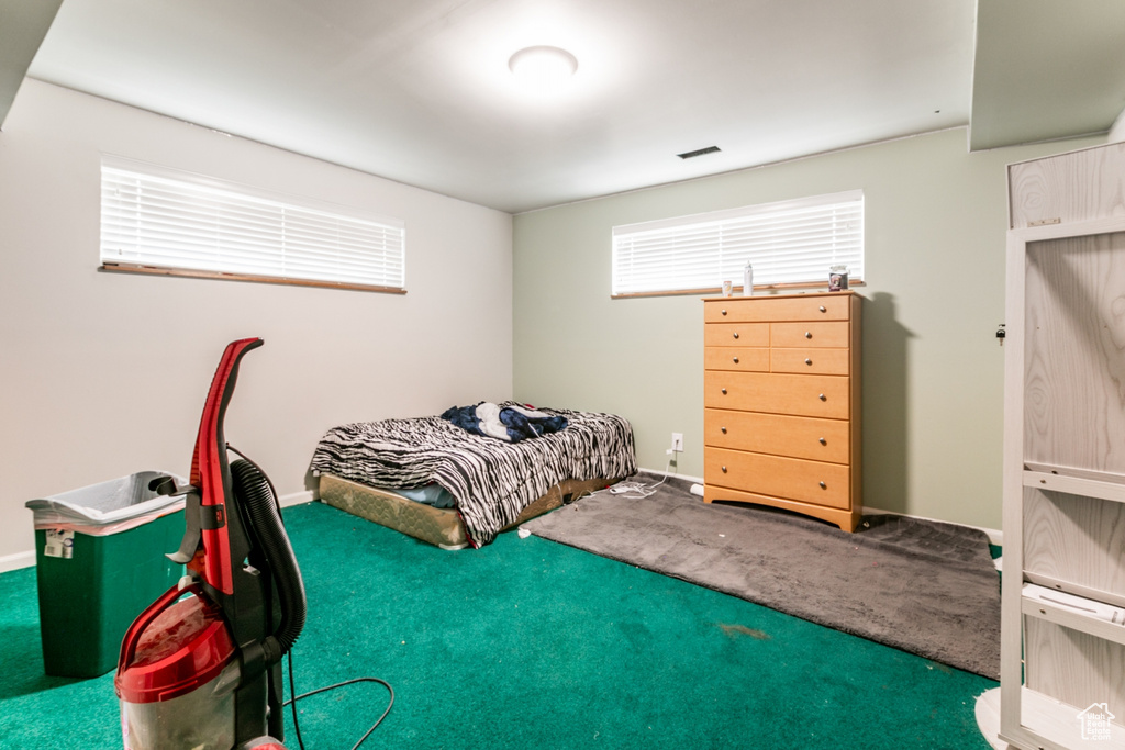 Bedroom with carpet and baseboards