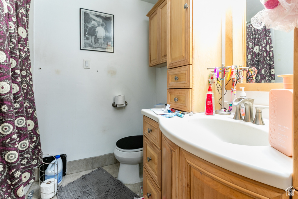 Full bathroom featuring vanity and tile patterned floors