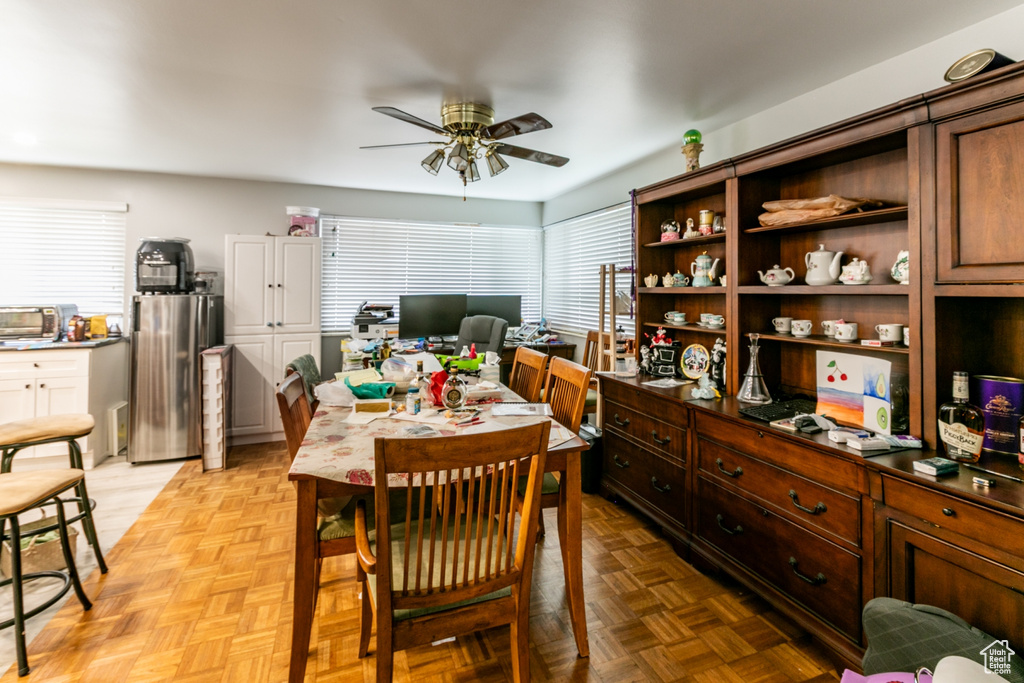 Dining area featuring a ceiling fan and a desk