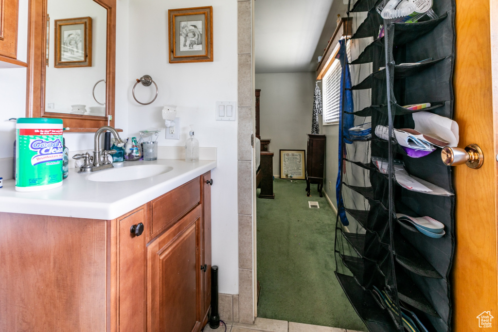 Bathroom with vanity and baseboards