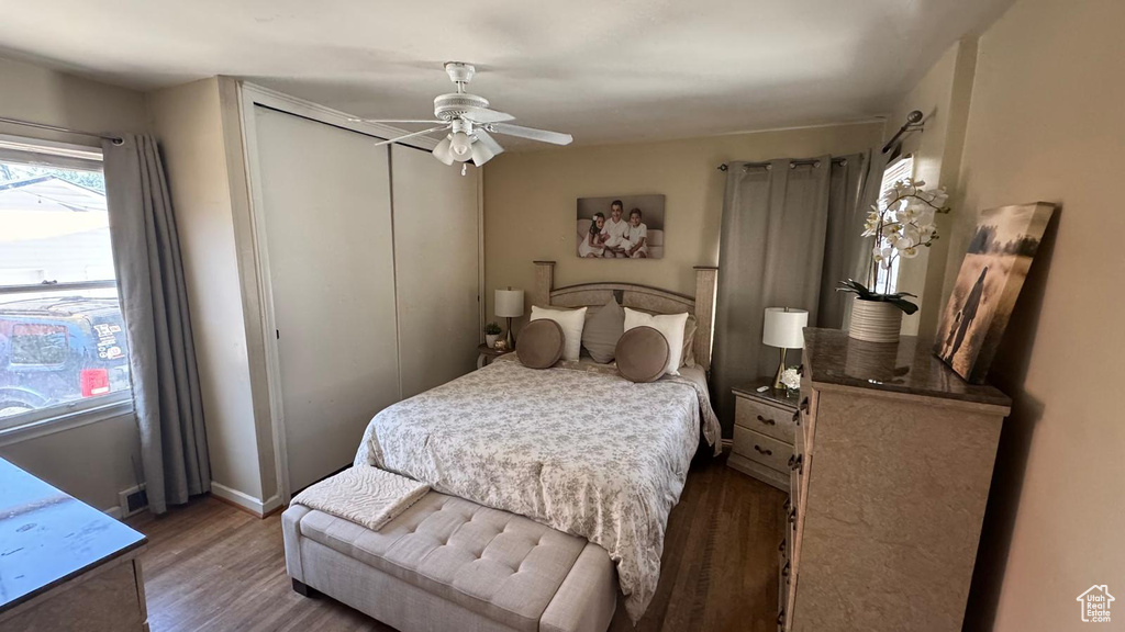Bedroom featuring wood finished floors, a closet, and ceiling fan