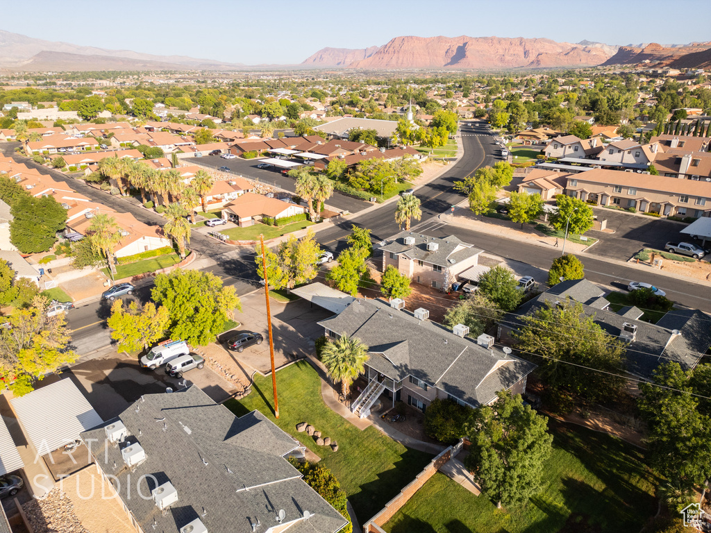 Aerial view of residential area featuring a mountainous background
