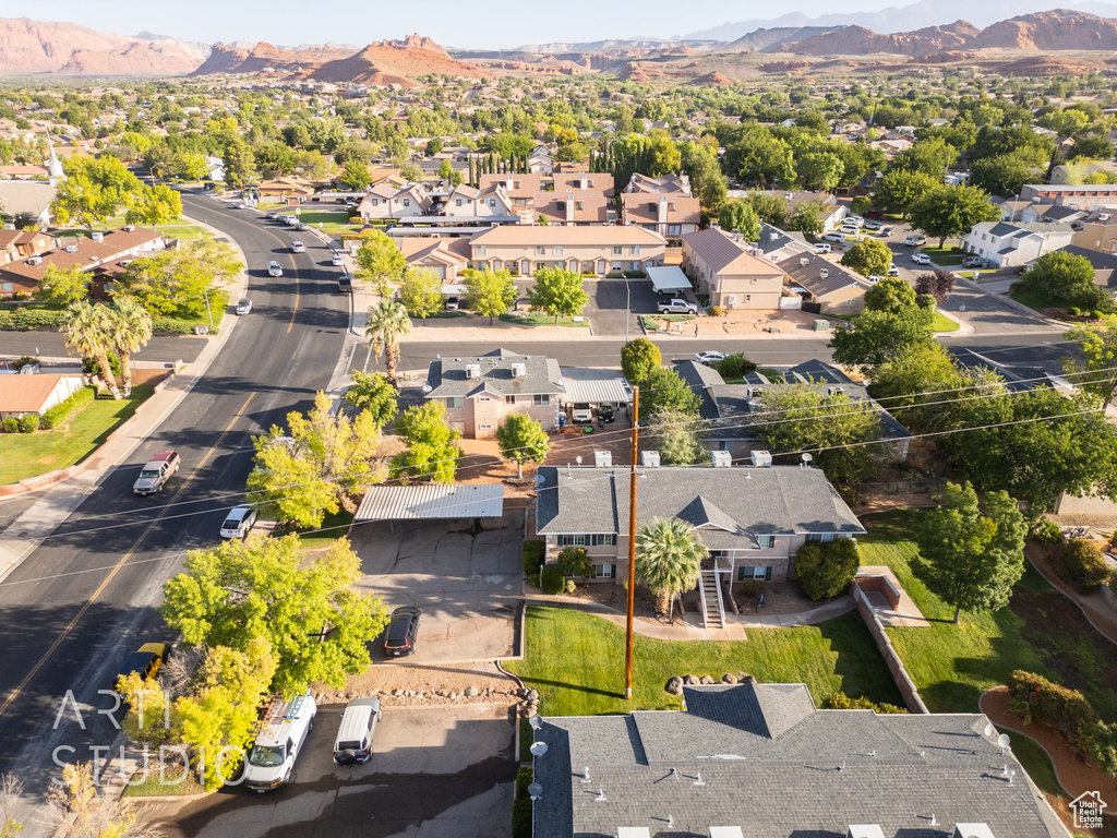 Aerial perspective of suburban area with a mountainous background