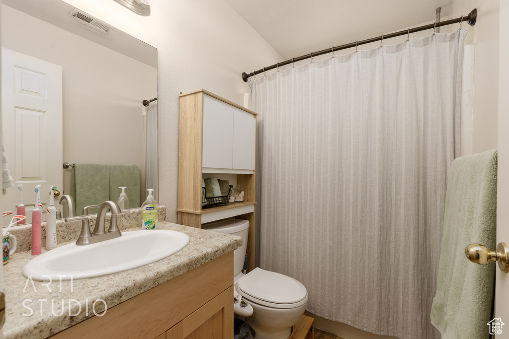 Full bath with vanity and toilet