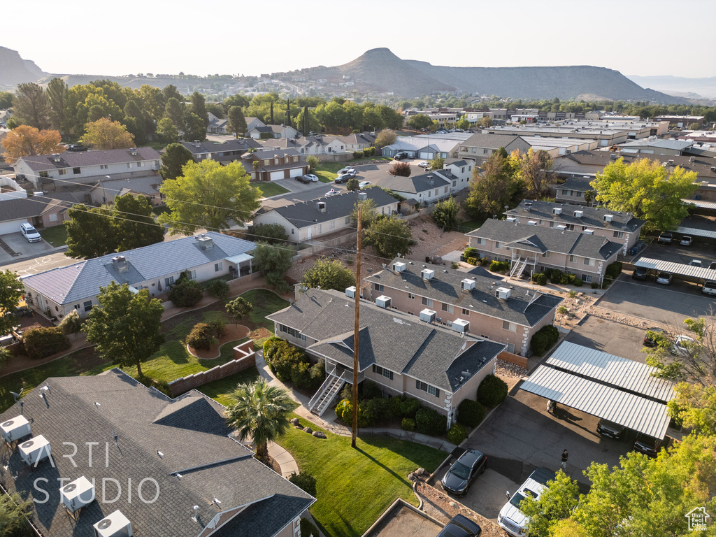 Aerial perspective of suburban area featuring a mountainous background