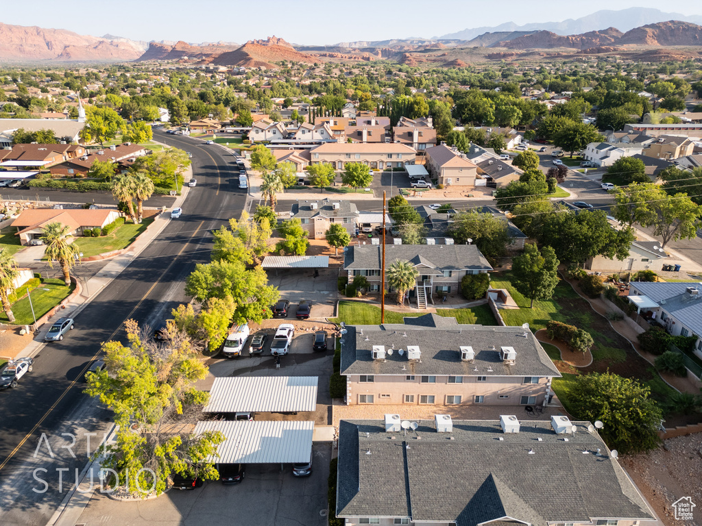 Aerial perspective of suburban area with a mountain backdrop