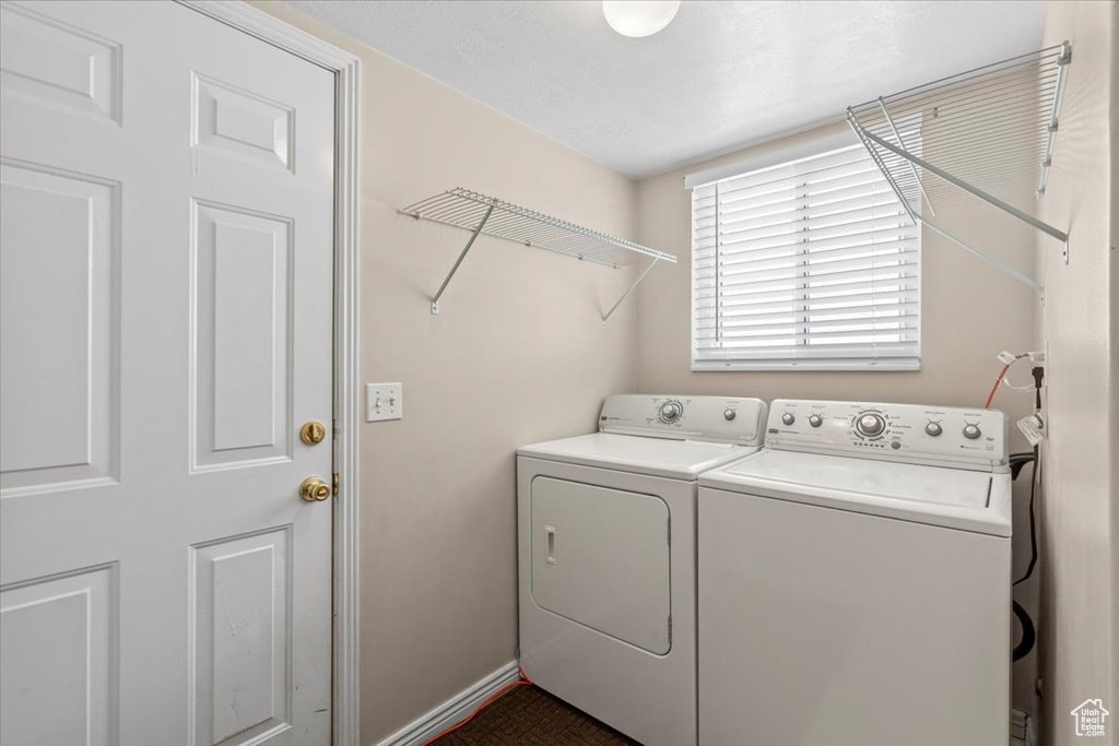 Washroom featuring washer and dryer