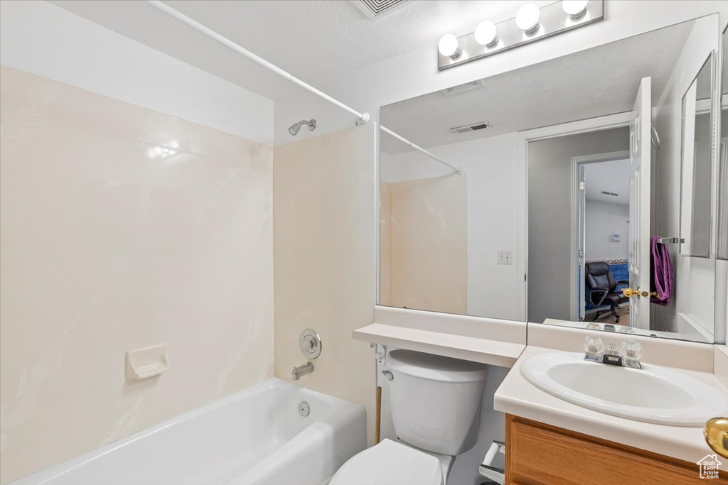 Bathroom featuring shower / washtub combination and vanity