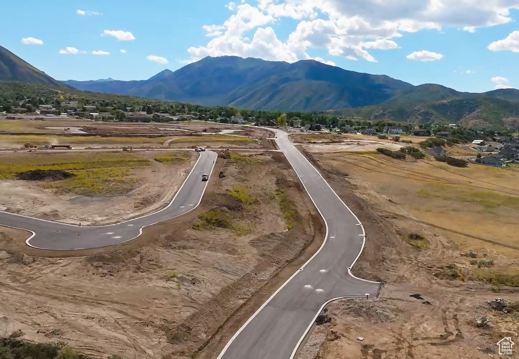 Aerial overview of property's location featuring a mountain backdrop