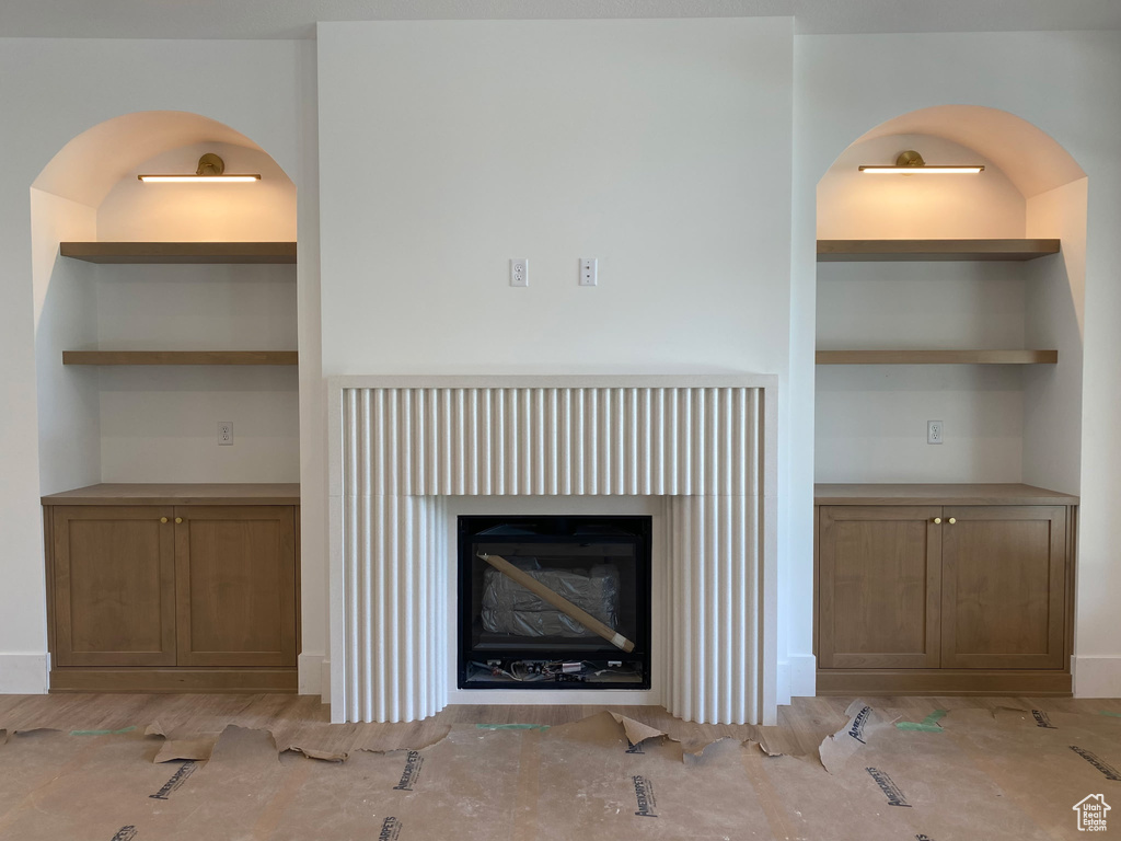 Detailed view of a fireplace and arched walkways