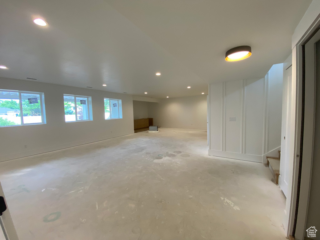 Basement with recessed lighting and stairway