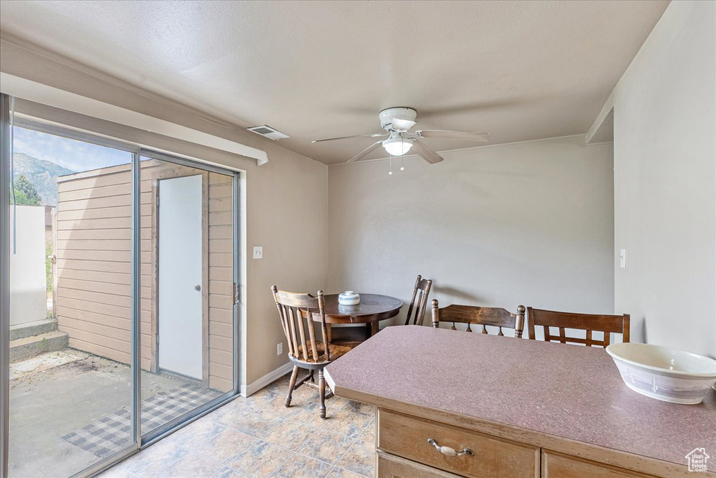 Dining area with ceiling fan