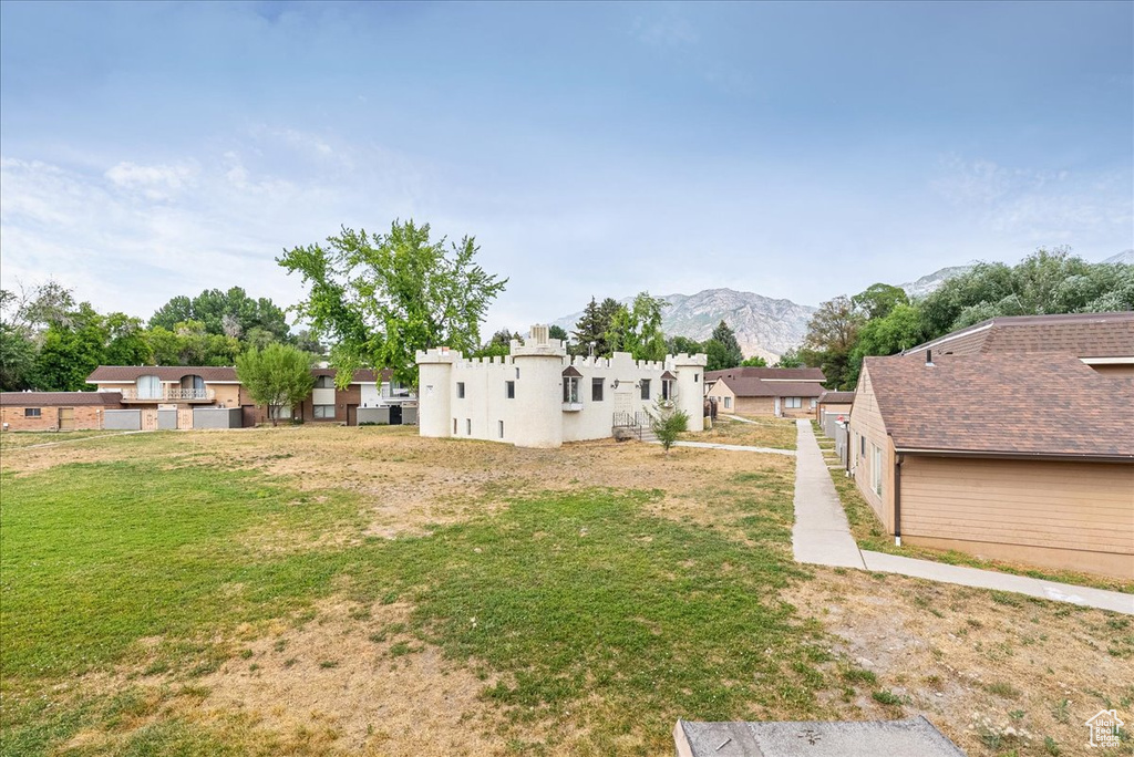 View of yard with a mountain view and a residential view