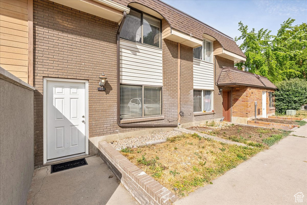 Property entrance with brick siding