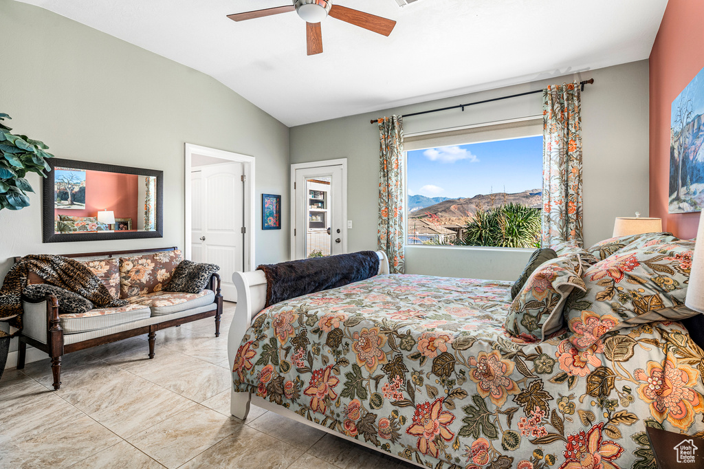 Bedroom with vaulted ceiling and a ceiling fan
